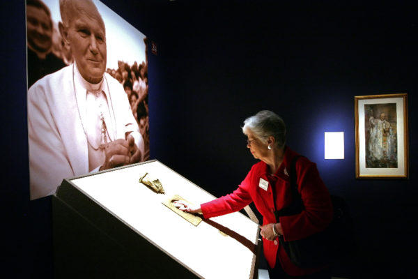 Joan Tinsky places her hand into a cast of the hand of Pope John Paul II during a special media preview of Vatican Splendors: A Journey through Faith and Art Thursday Jan 27, 2011 at the Museum of Art/Fort Lauderdale in Fort Lauderdale.  Museum of Art | Fort Lauderdale will host Vatican Splendors: A Journey through Faith and Art beginning January 29. ÊThe exhibition features nearly 200 rare works of art and historically significant objects, many of which have never left the Vatican.   Fort Lauderdale is one of only three U.S. cities to host Vatican Splendors.  (Museum of Art/Fort Lauderdale, David Adame)