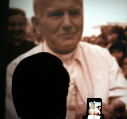 James Ewing uses his smart phone to photograph a cast of the hand of Pope John Paul II during a special media preview of Vatican Splendors: A Journey through Faith and Art Thursday Jan 27, 2011 at the Museum of Art/Fort Lauderdale in Fort Lauderdale.  Museum of Art | Fort Lauderdale will host Vatican Splendors: A Journey through Faith and Art beginning January 29. ÊThe exhibition features nearly 200 rare works of art and historically significant objects, many of which have never left the Vatican.   Fort Lauderdale is one of only three U.S. cities to host Vatican Splendors.  (Museum of Art/Fort Lauderdale, David Adame)