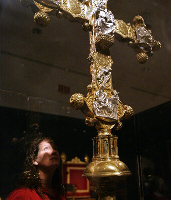 Chelsea L. Marando examines a processional cross during a special media preview of Vatican Splendors: A Journey through Faith and Art Thursday Jan 27, 2011 at the Museum of Art/Fort Lauderdale in Fort Lauderdale.  Museum of Art | Fort Lauderdale will host Vatican Splendors: A Journey through Faith and Art beginning January 29. ÊThe exhibition features nearly 200 rare works of art and historically significant objects, many of which have never left the Vatican.   Fort Lauderdale is one of only three U.S. cities to host Vatican Splendors.  (Museum of Art/Fort Lauderdale, David Adame)